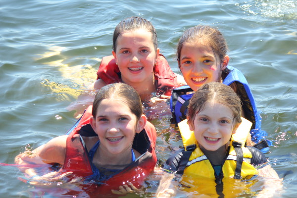 Swimming in Lake Cobbosseecontee in Maine at all girls camp Kippewa