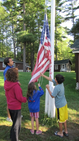 raising the flag at family camp at camp kippewa