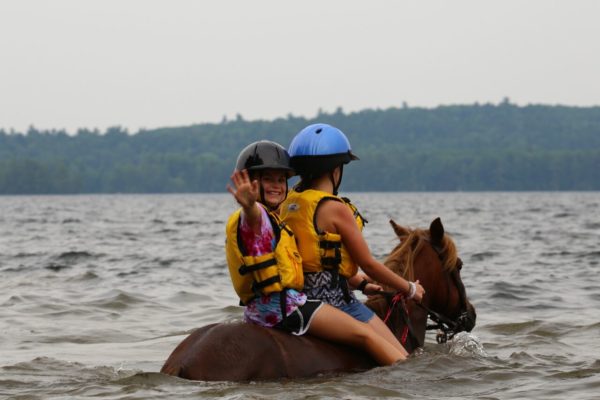 Horses and fun at all girls horseback riding camp equestrian instructors in Maine