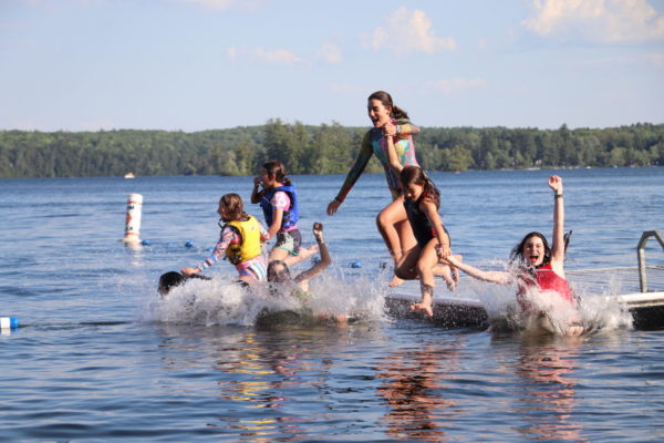 Swim in lake in Maine at all girls horseback riding camp