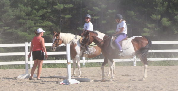 Mary Paige best horse trainer instructor teaches girls to ride horses at all girls camp in Maine