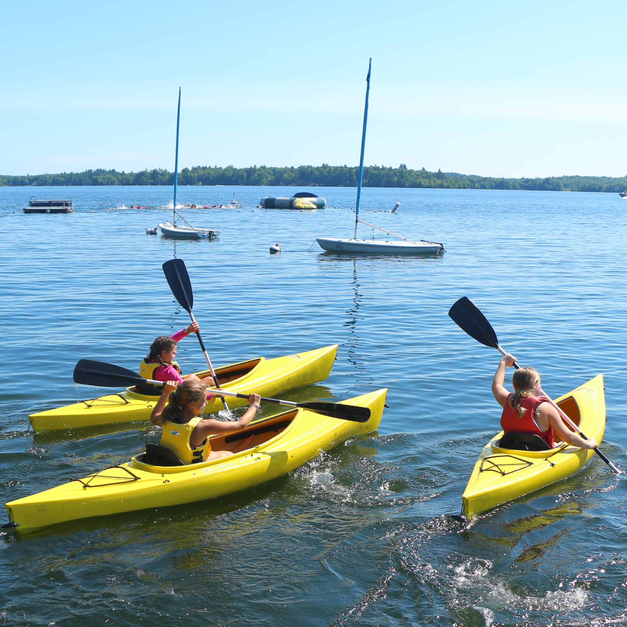 Kayaks on lake cobbosseecontee girls camp in Maine